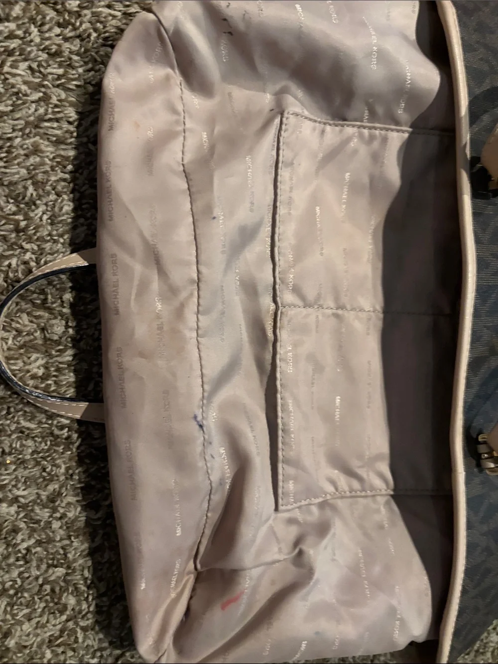 Michael Kors Brown Tote with tan trim does have some spots on inside